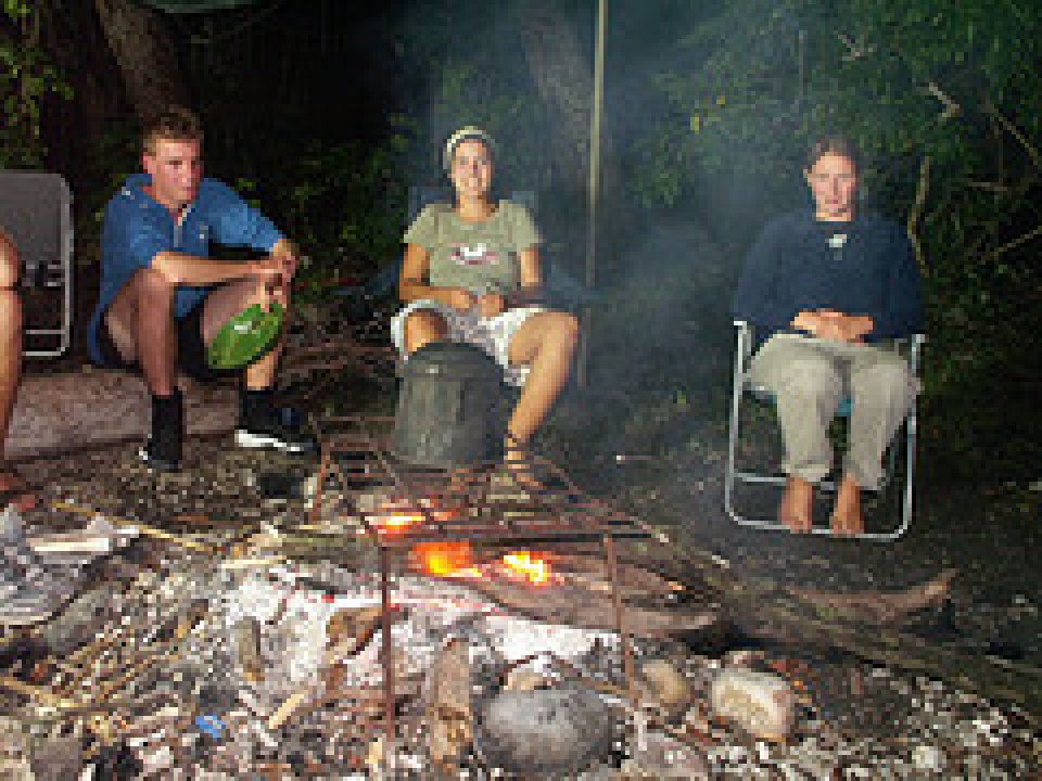 Pelorus Island - Eating dinner by the light of the campfire. 